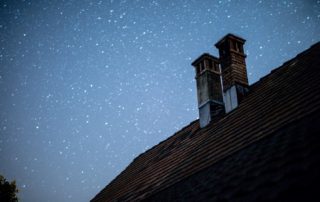 Chimney against a starry night sky