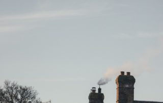 a chimney emitting black smoke