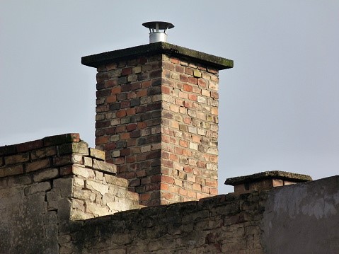 Damaged brick chimney