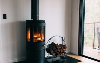 A black chimney system set up in a living room